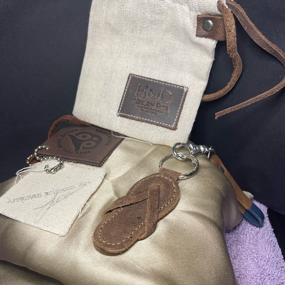 Hide and Drink leather flip flop key chain in bag